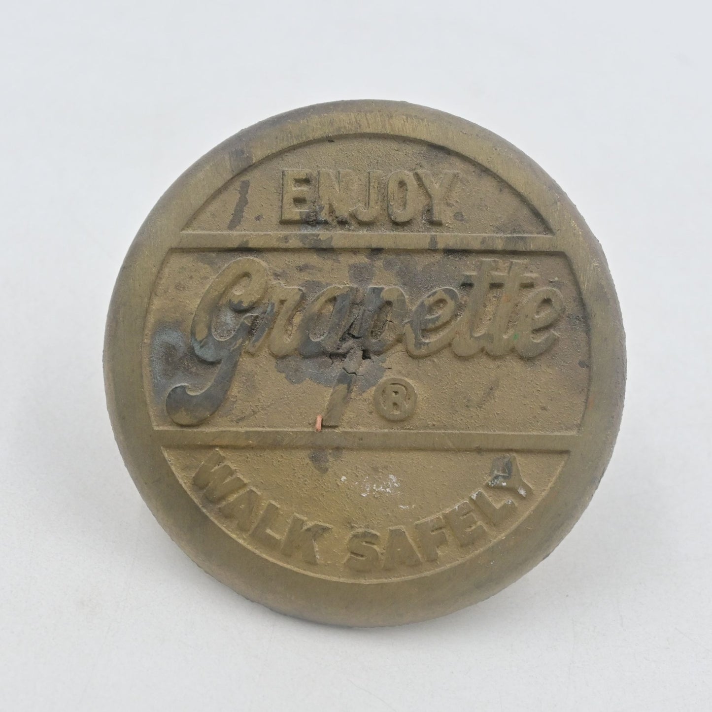 Enjoy Grapette Soda Walk Safely Heavy Brass Sidewalk Marker Vintage