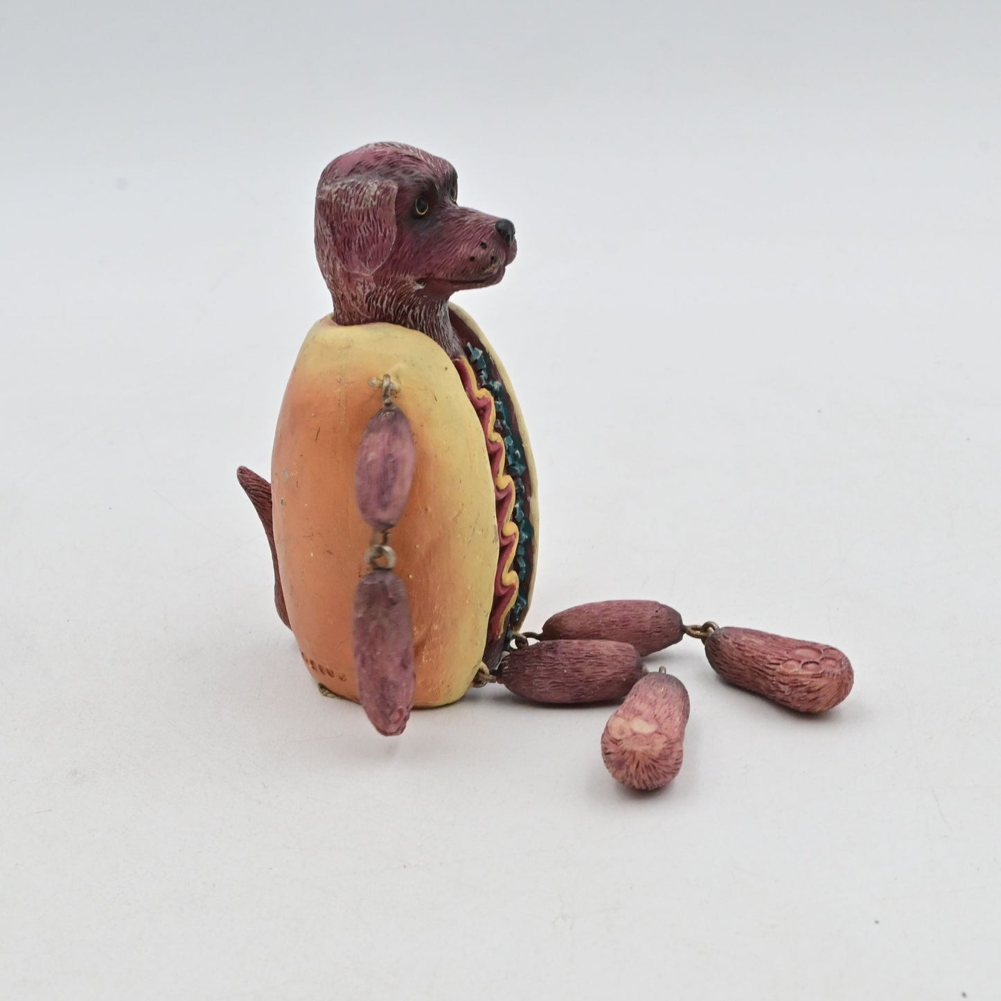 Dog-In-Hotdog Costume Figurine With Dangling Legs Arms